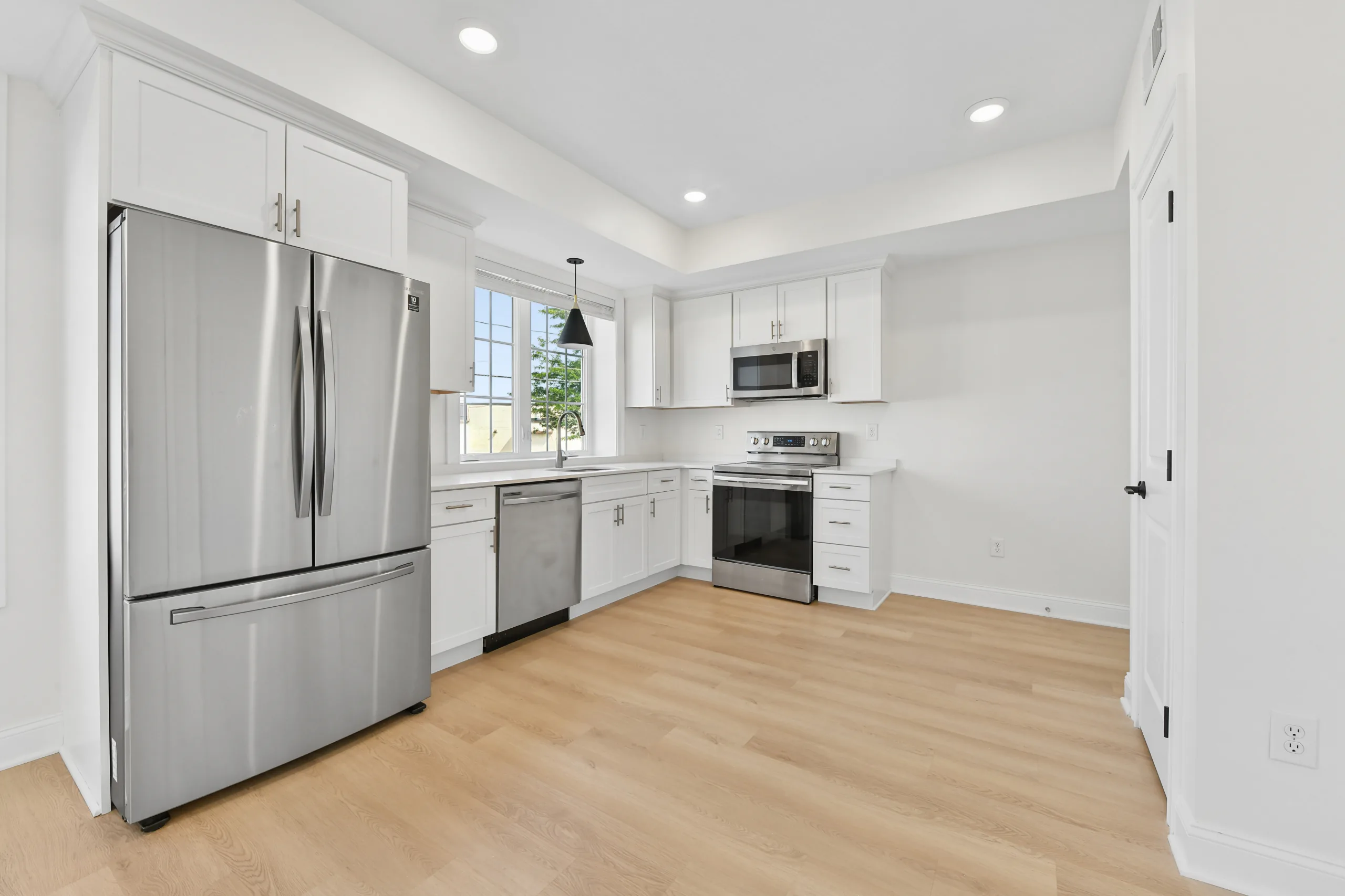 Kitchen detail with fridge freezer and range at 55 Monk St