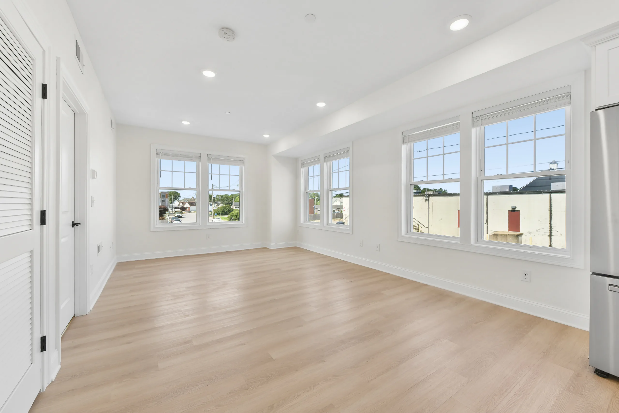 Living space with multiple windows at 55 Monk St